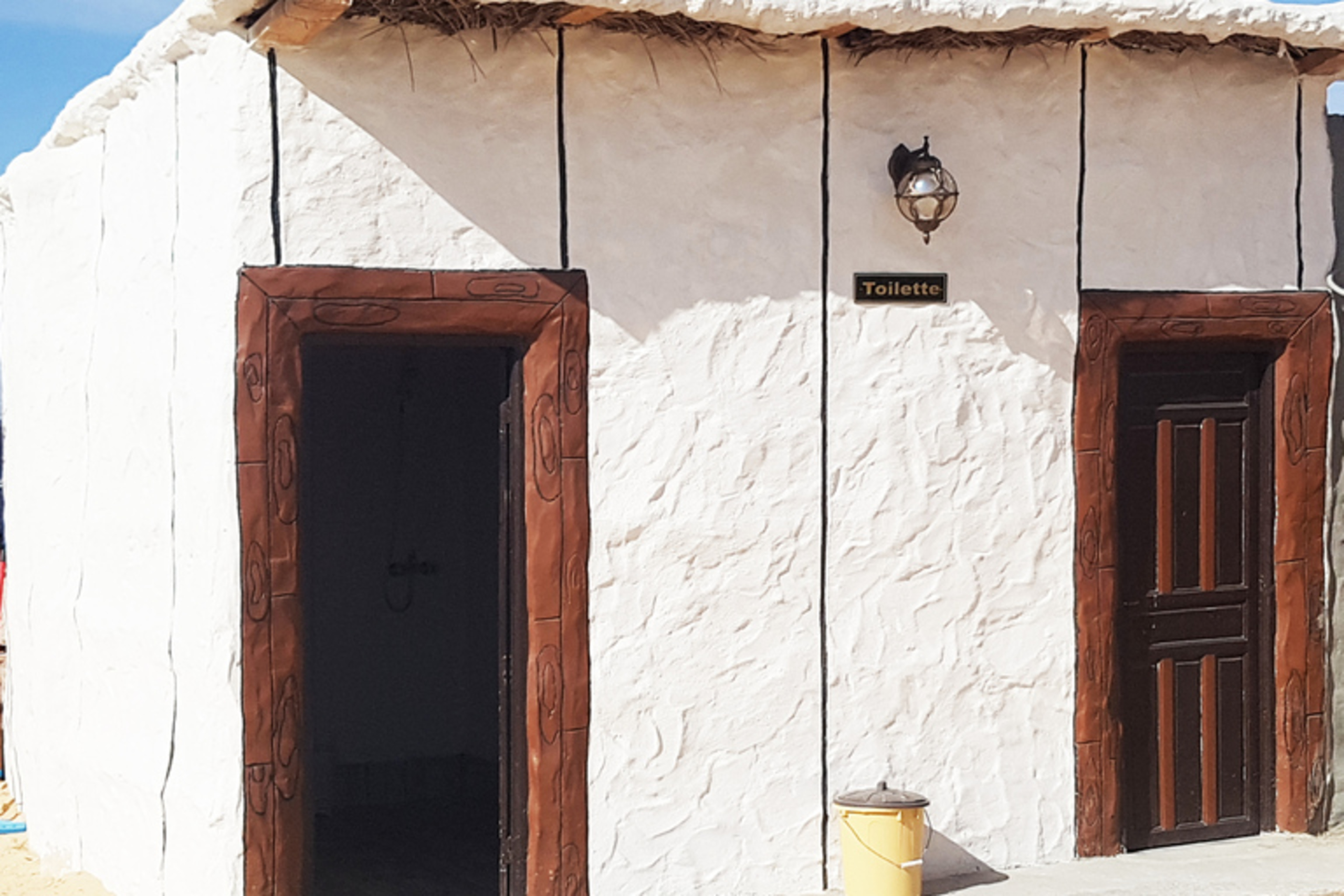 Shared bathroom facilities at the desert camp during the Douz Sahara tour