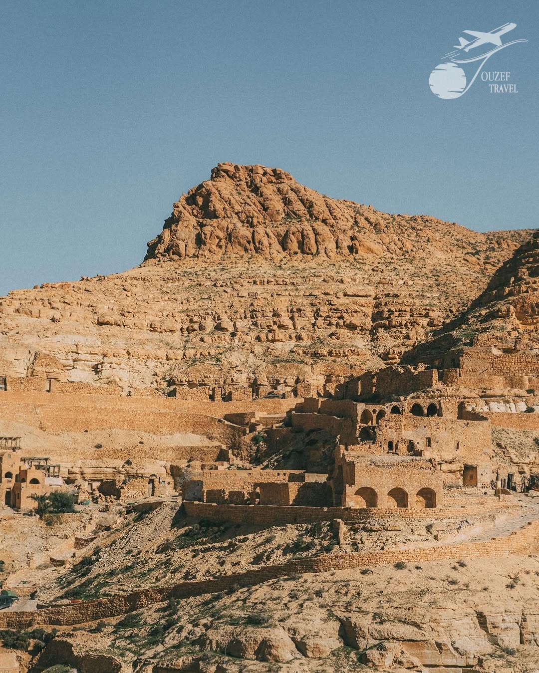 View of Chenini, a Berber mountain village with cave houses and historical mosques in southern Tunisia
